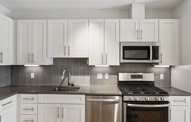 Modern Kitchen with stove top oven at Park77 Apartments, Cambridge, MA, 02138