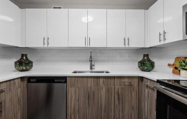 a kitchen with white countertops and wooden cabinets