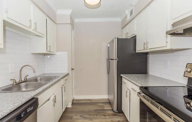 a kitchen with a stove and a sink