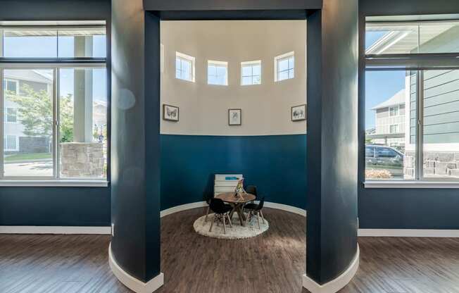 a conference room with large windows and a table with a chair