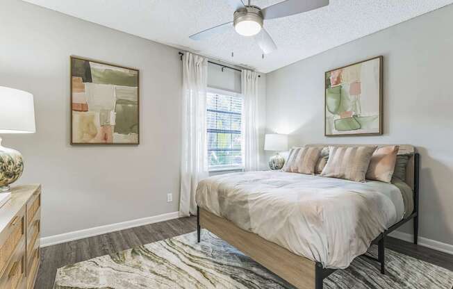 Bedroom with a large bed and a window at The Atlantic Preserve, Plantation, FL