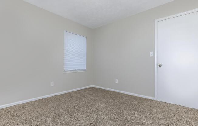 a bedroom with a large mirror