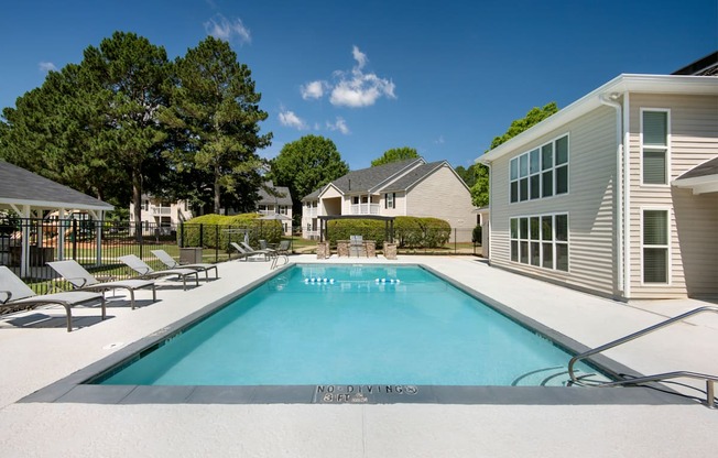 the swimming pool at villas on the avenue apartments