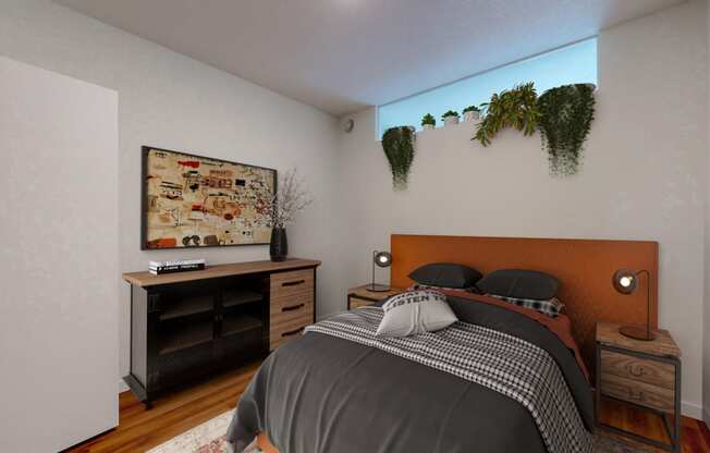 a bedroom with a bed and a window with plants on the wall