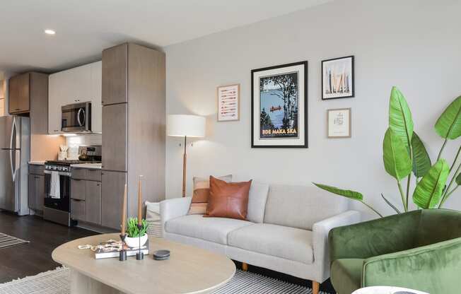 a living room with a couch and a table at The Bohen Apartments , Minnesota, 55408