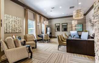 a lobby with chairs and a desk with a computer at Echo at Lake Norman, Mooresville, NC