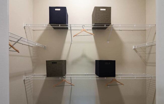 a group of speakers on a rack in a room
