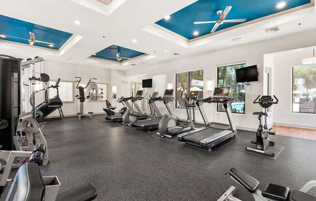 A spacious gym with a variety of exercise equipment.