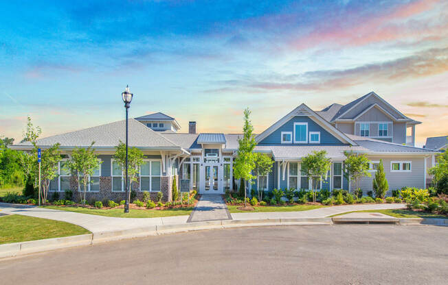 The Highland leasing office and resident clubhouse exterior with lush landscaping