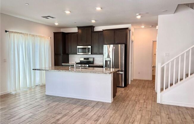 Spacious Townhome with Loft, Granite Kitchen & Community Pool in Gated Neighborhood