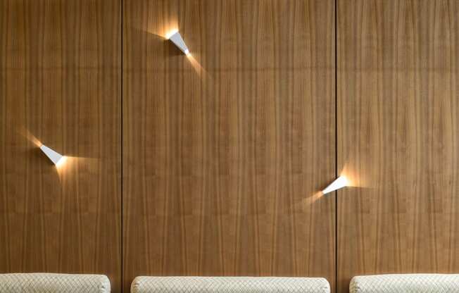 lounge area seating with lights on wall | The Merc building