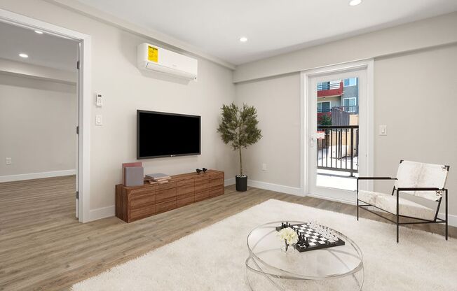 a living room with a tv and a table