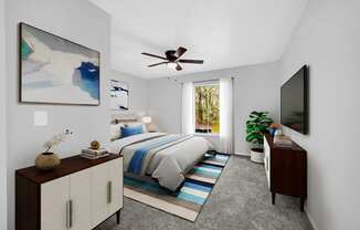 a bedroom with a bed and a ceiling fan at Southern Oaks Residences