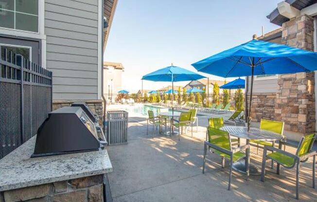 Barbecue And Grilling Station with sitting space at Parc on Center Apartments & Townhomes, Orem, Utah
