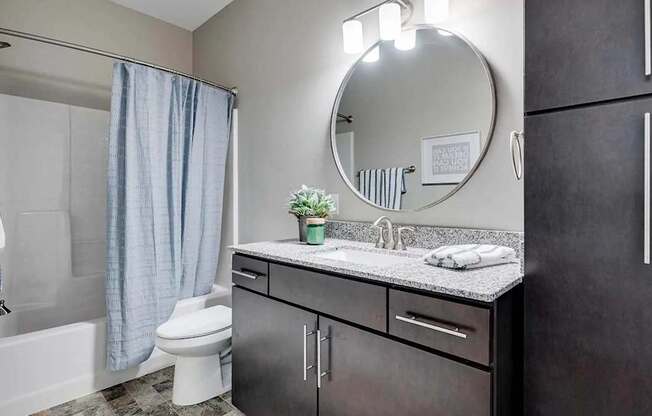 a bathroom with a sink and a toilet. Circle Pines, MN Lexington Lofts