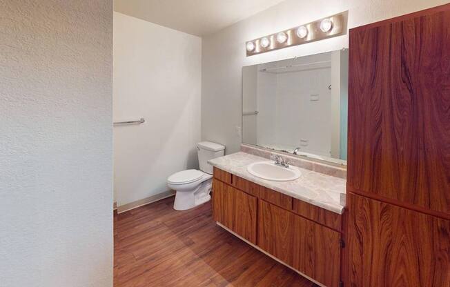 Alternate view of the living room at Heritage Grove Apartments Renton WA highlighting the open layout and natural light from large windows.