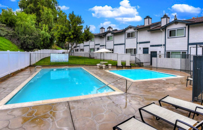 rectangular swimming pool with wadding pool adjacent to it