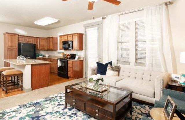 Living Room with Kitchen View at San Tropez Apartments & Townhomes, Utah