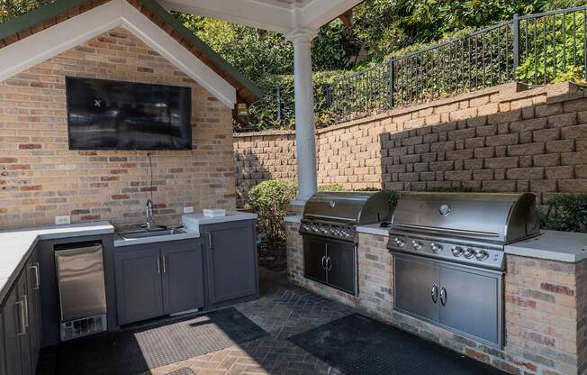 A brick wall with a TV mounted on it.