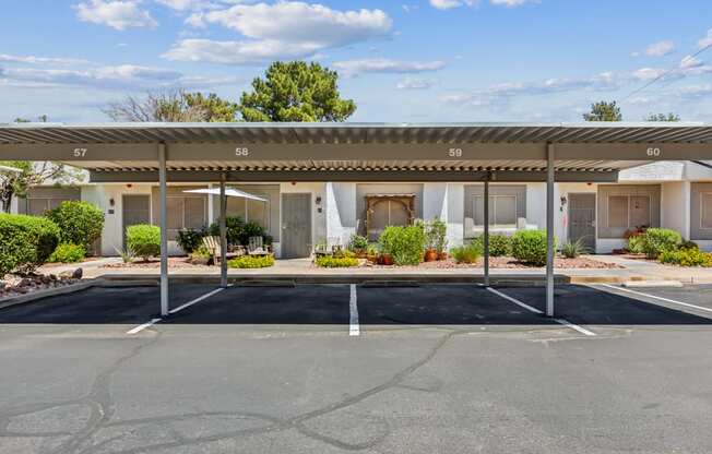 an empty parking lot in front of a motel building