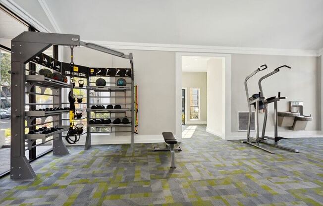 Indoor Fitness Center Weight Area at Caribbean Breeze Apartments in Tampa, FL.
