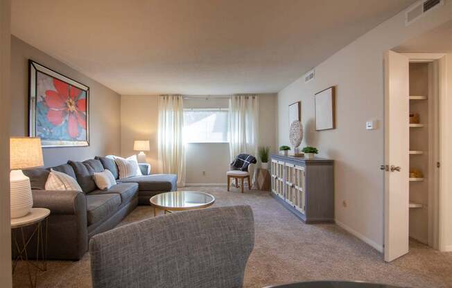 This is a photo of the living room in the 822 square foot, 2 bedroom, 1 bath floor plan at Village East Apartments in Franklin, OH.