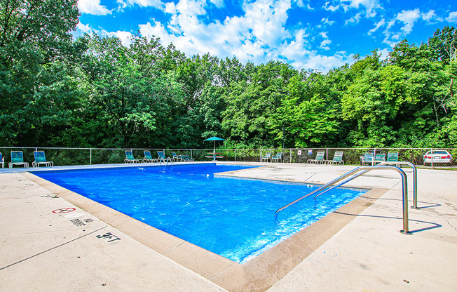 take a dip in the heated pool at the enclave at woodbridge apartments in sugar land,