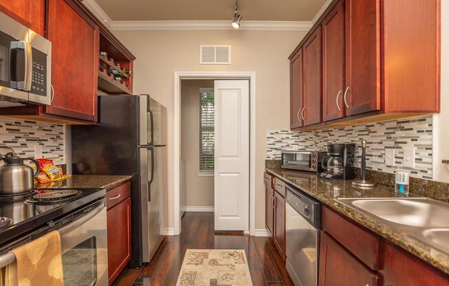 a large kitchen with stainless steel appliances