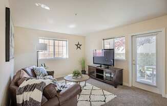 a living room with a couch and a tv  at Quail Springs, Washington, 99353