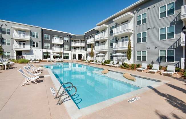 Refreshing swimming pool with sun ledge at The Barrett, Marietta, 30066