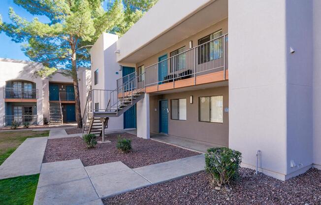 A modern building with a balcony and a staircase.