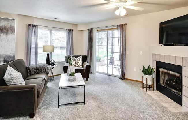 Living Room With TV And Fireplace at Tranquility Pointe, Omaha, NE, 68164