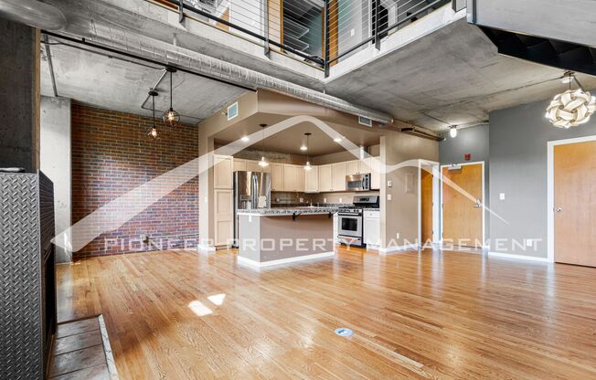 Modern Industrial Condo Downtown with Parking!