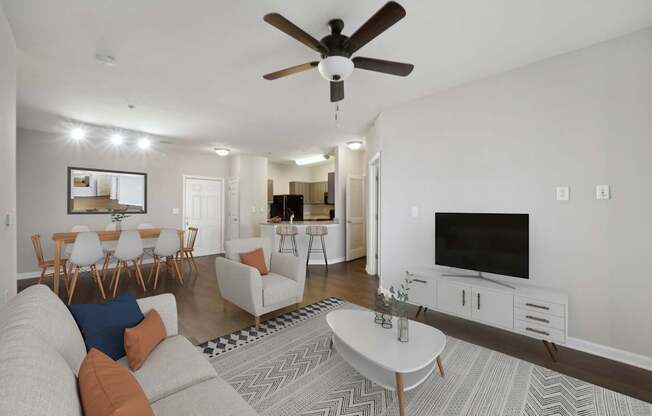 a living room with a couch and a tv at MetroPlace at Town Center, Maryland