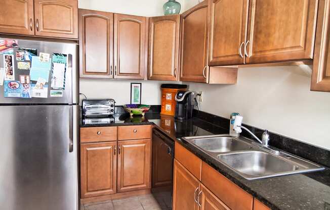 Kitchen with Stainless Steel Appliances at Integrity Gold Coast Apartments in Lakewood, Ohio, 44102