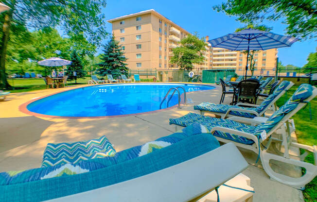 Blue Swimming Pool with Shaded Lounge Chairs at Westwood Meadows, Westlake, OH, 44145