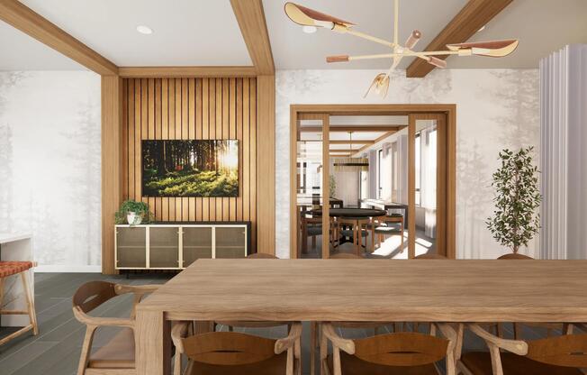 The game room lounge at Modera Bridle Trails offers cozy seating and warm wood tones, creating a comfortable place to relax and unwind.