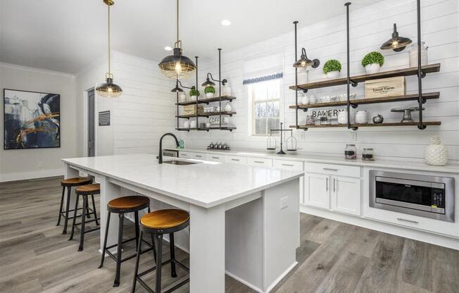 a kitchen with a large white counter top