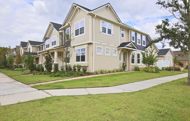 Beautifully Appointment 3/2 Modern Townhome with a Paved Courtyard and a Detached 2 Car Garage in the Desirable Community of Randal Park - Orlando!