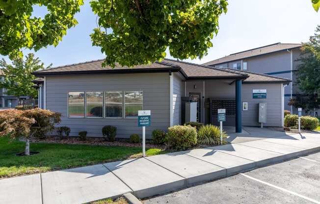 a small gray house with a sidewalk in front of it  at Shoreline Village, Washington