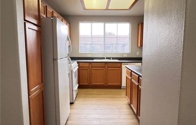 Bright 2-Bed Condo with Dual Balconies, Garage & Community Amenities!