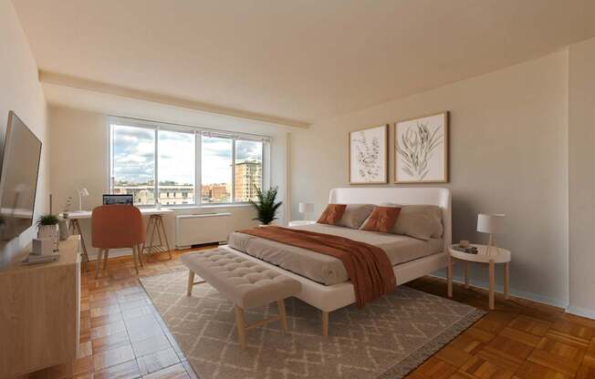 A modern bedroom with a large bed and a television.