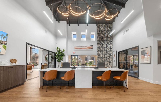 A modern office space with a long table and chairs.