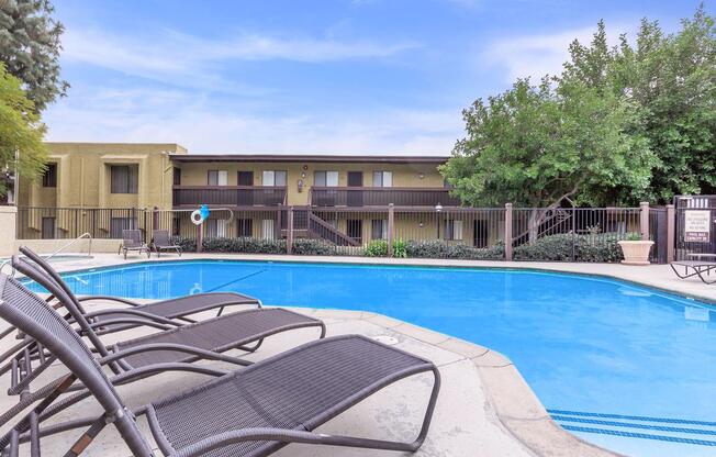 a chair sitting in front of a pool