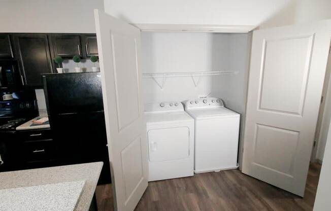 a white washer and dryer in a room at Mosaic Apartments in Avon, Indiana