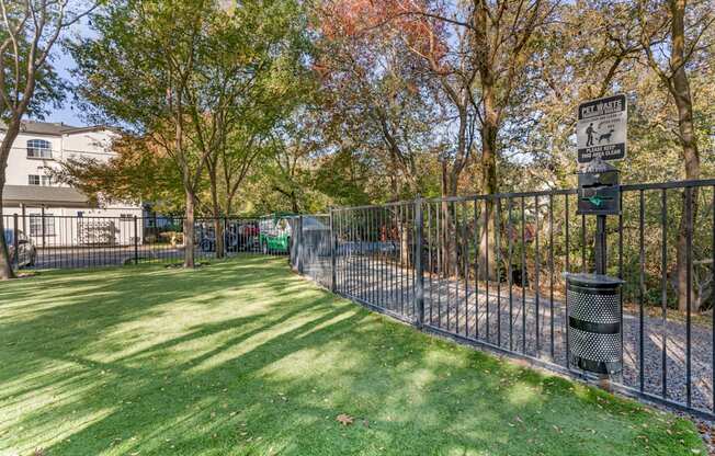 Our newly renovated dog park is now open, featuring fresh turf and plenty of space for your furry friends to play and socialize.