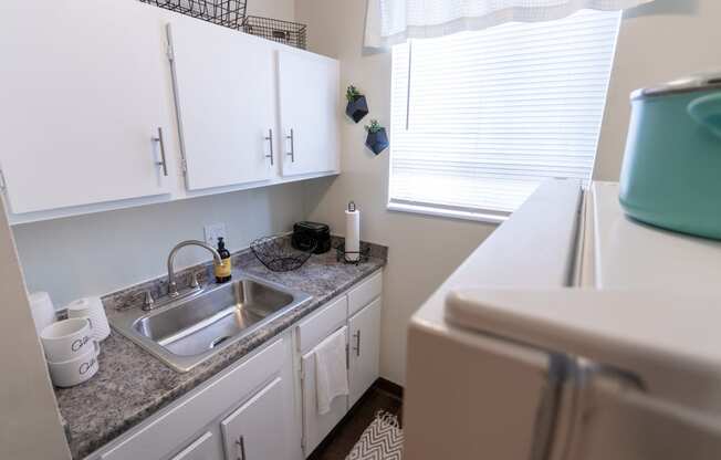 This is a picture of the kitchen in a 576 sq foot 1 bedroom, 1 bath apartment at Red Bank Reserve in the Madisonville neighborhood of Cincinnati, Ohio.