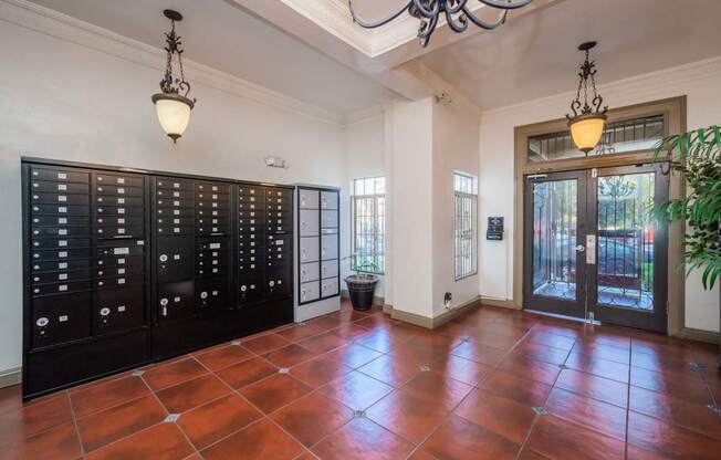 A room with a black cabinet and a brown floor.