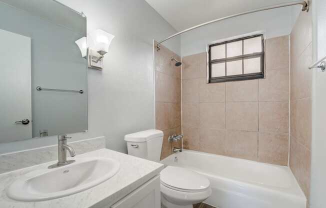 Renovated Apartment Home Bathroom at The Flats at Seminole Heights at 4111 N Poplar Ave in Tampa, FL