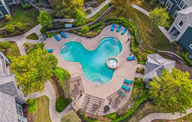 an overhead view of a swimming pool and a resort style pool
